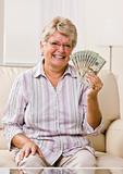Senior woman holding cash
