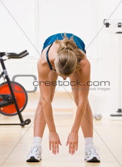 Woman exercising in health club