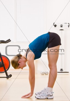 Woman exercising in health club