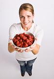 Woman holding bowl of raspberries
