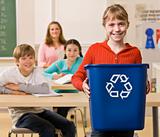 Student carrying recycling bin