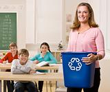 Teacher holding recycling bin