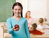 Student holding apple