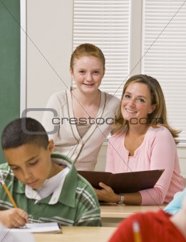 Teacher helping student