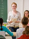 Student giving report in classroom