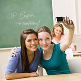 Students taking self-portrait in classroom