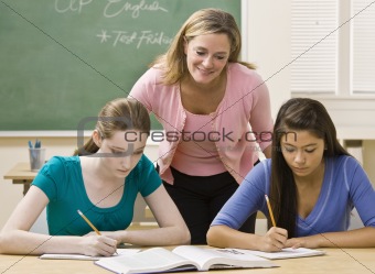 Teacher helping students study