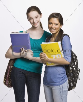 Students carrying book bag, backpack and notebooks