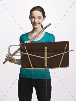 Teenage girl playing flute