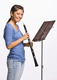 Teenage girl playing clarinet