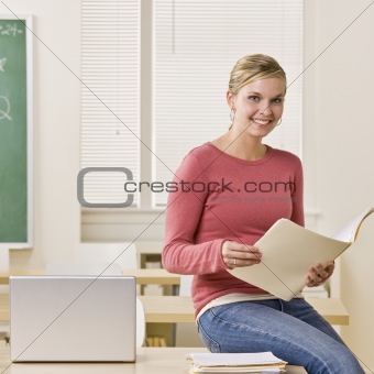 Student holding file folder
