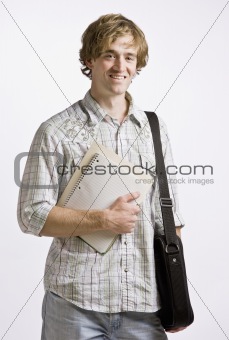 Student carrying books and briefcase