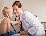 Doctor giving boy checkup in doctorÕs office