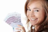 Happy young woman holding money