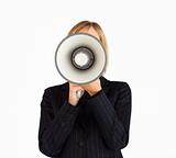 Closeup of a businesswoman with a megaphone hiding her face