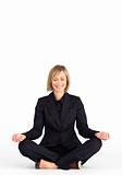 Mature businesswoman doing meditation exercises
