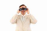 Friendly businessman looking through binoculars 