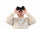 Confident businessman looking through binoculars 