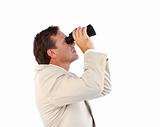 Attractive businessman holding binoculars 
