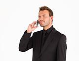 Attractive serious businessman talking on phone