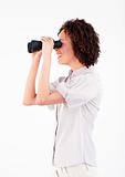 Young businesswoman looking through binoculars 
