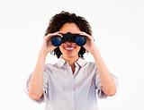 Close-up of smiling businesswoman looking through binoculars
