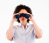 Young businesswoman searching for something with binoculars