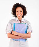 Businesswoman holding folders smiling at the camera 