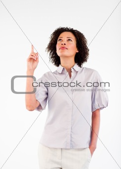 Serious female businessmanager pointing upwards