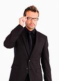 Young businessman with glasses looking at the camera 