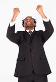Happy businessman with raised arms 