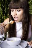 Woman eating a shrimp