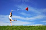 girl with a red ball in the form of heart
