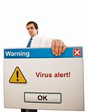 Serious businessman with computer virus alert