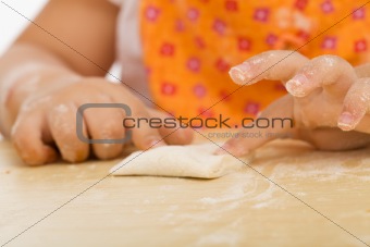 Little girl making cookies series