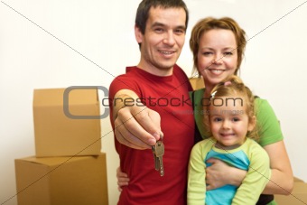 Family with the keys of their new home