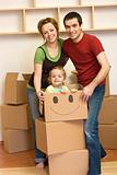 Happy family unpacking in a new home