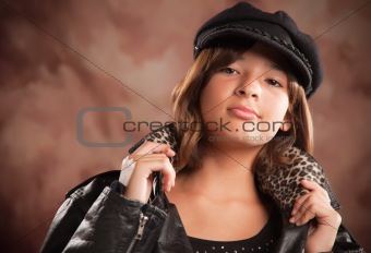 Pretty Hispanic Girl with Hat and Leather Jacket Studio Portrait.