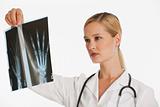 female doctor holding up xray