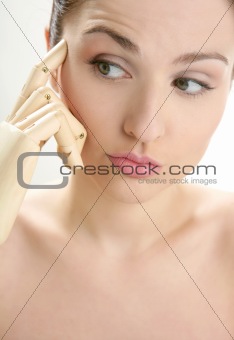 woman portrait thinking with mannequin hand