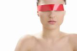Beautiful cosmetic woman, red tape in eyes