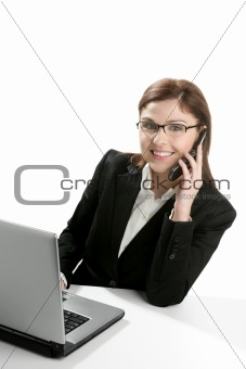 Businesswoman with laptop talking mobile phone 