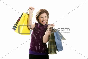 Shopaholic woman with colorful bags over white