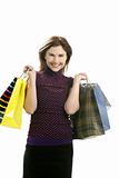 Shopaholic woman with colorful bags over white