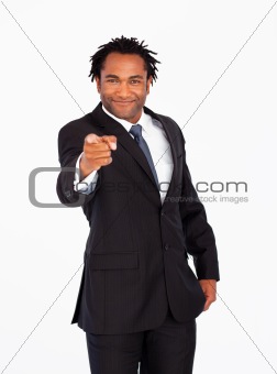 Friendly businessman pointing at the camera 