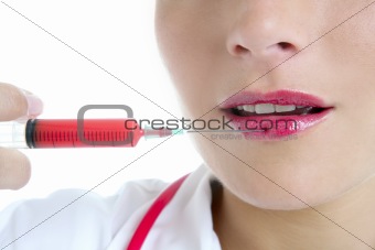 Doctor woman with red syringe in lips