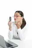 Businesswoman with lipstick and mobile phone