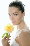 Beautiful woman portrait with yellow rose