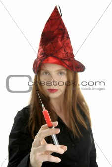 beautiful witch portrait with red syringe