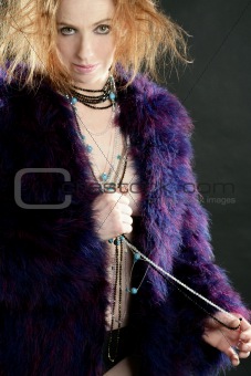 Beautiful sexy redhead woman, coat and jewelry